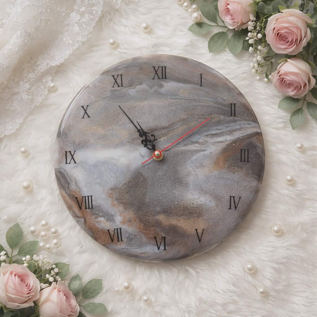 Marble-patterned clock with Roman numerals on a decorative background with flowers and pearls.
