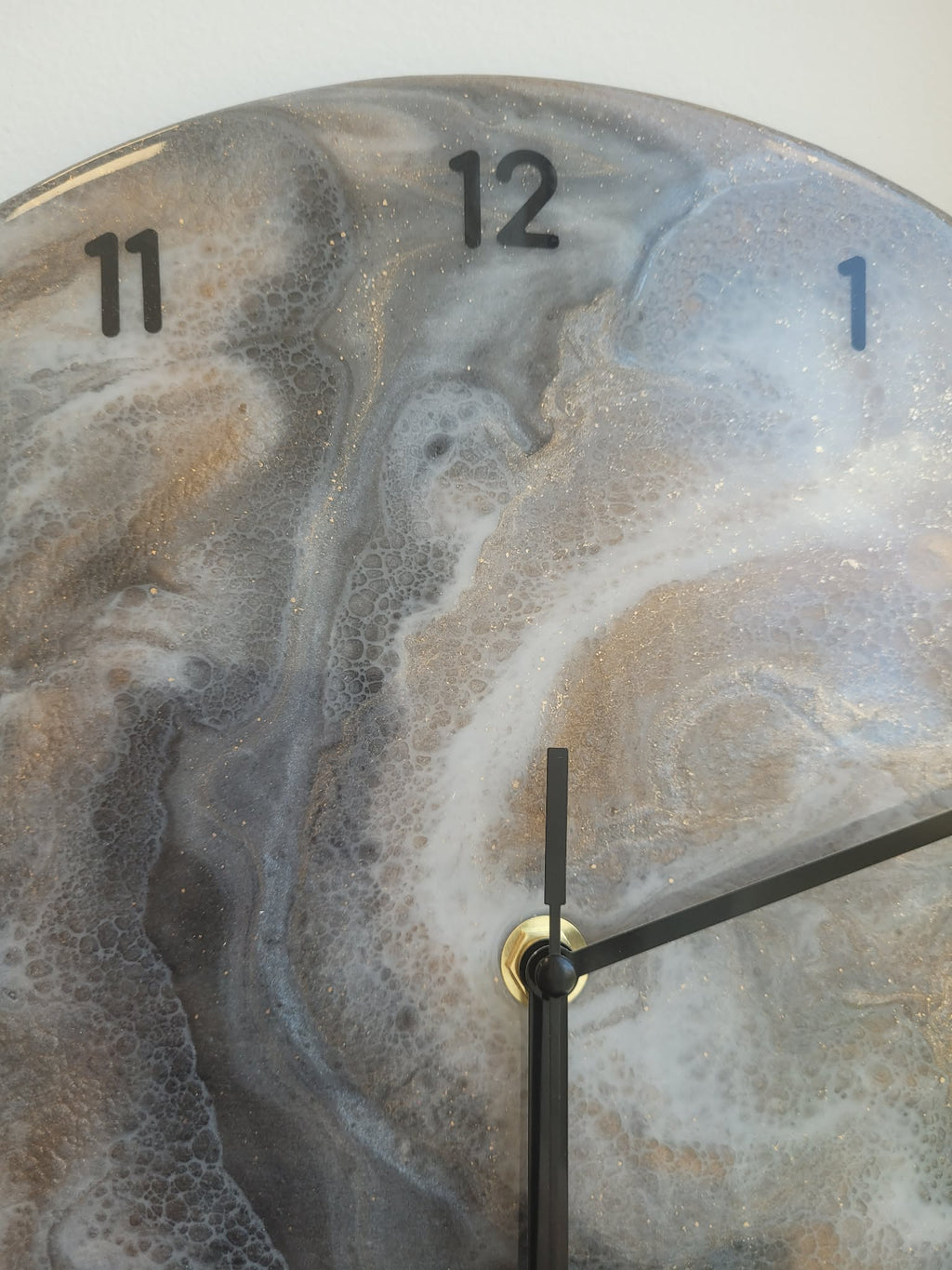 Clock with a marbled design on the face