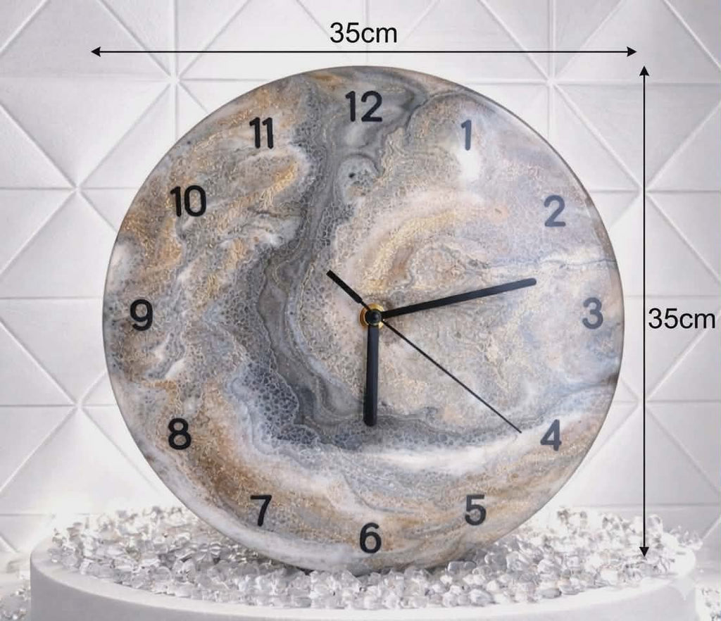 Round marble-patterned clock with measurements on a white textured background