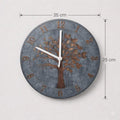 Round wall clock with tree design and measurements on a light gray background