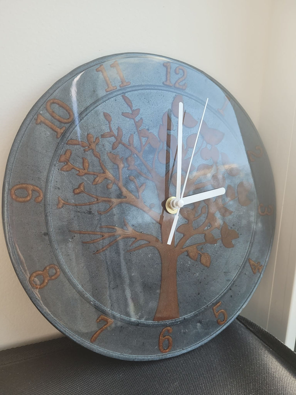 Wall clock with tree design and metallic finish