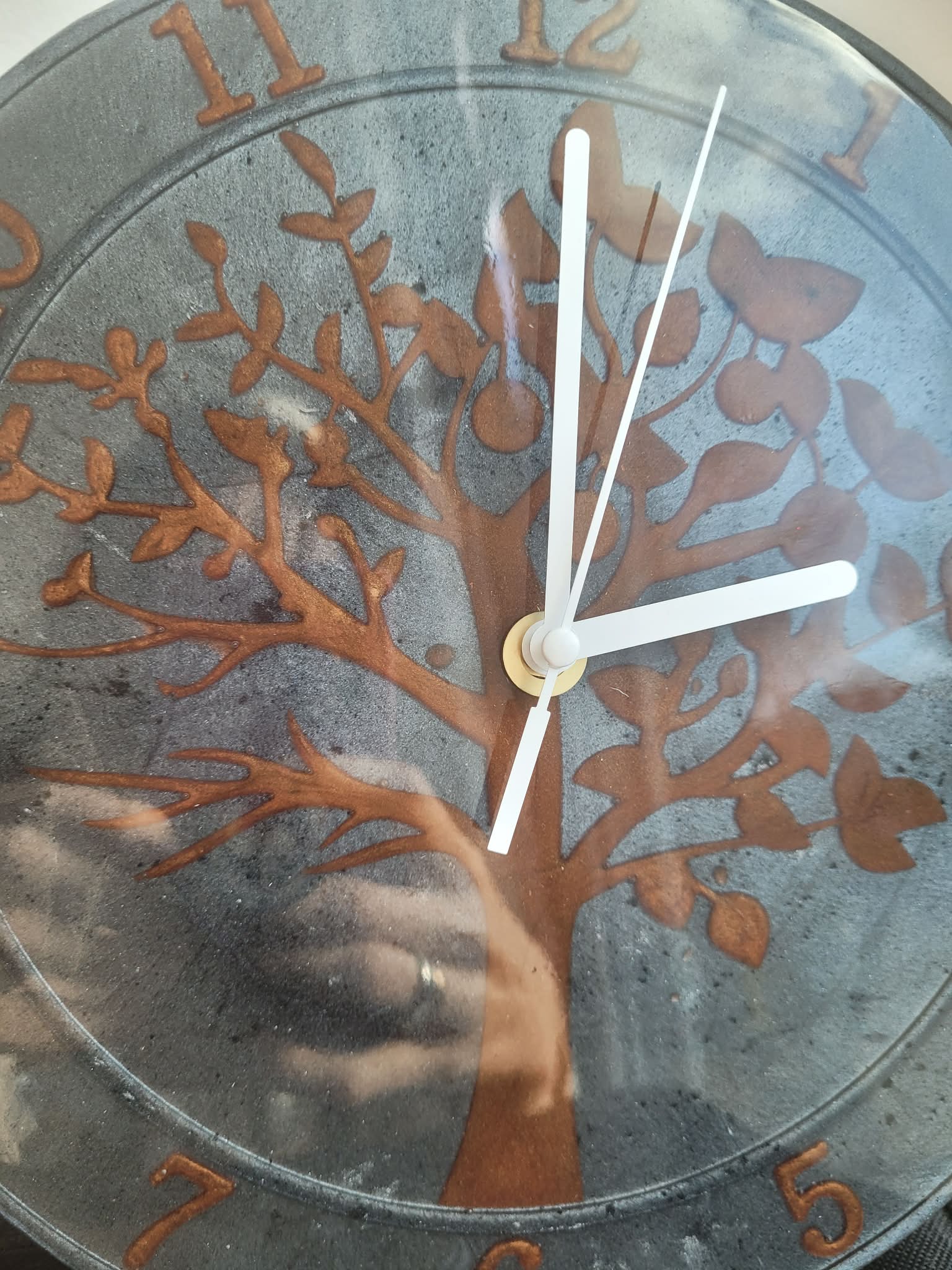 Decorative clock with tree design and metallic finish