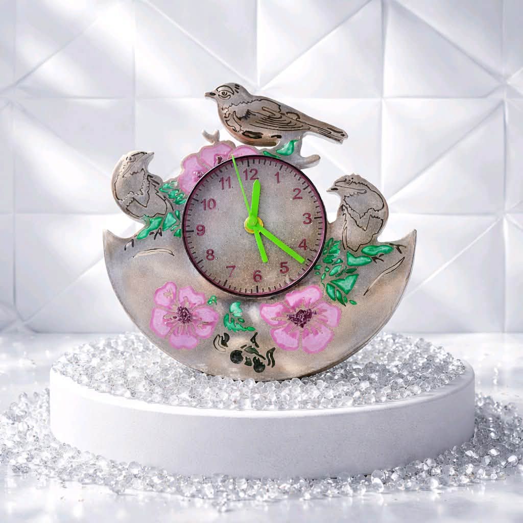 Decorative clock with birds and flowers on a white background