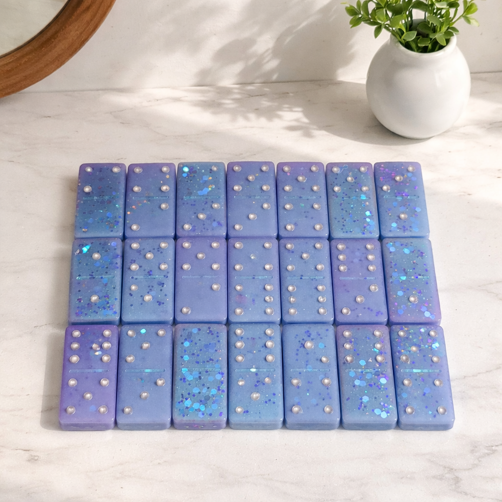 Handcrafted epoxy resin domino set with blue glitter, top view