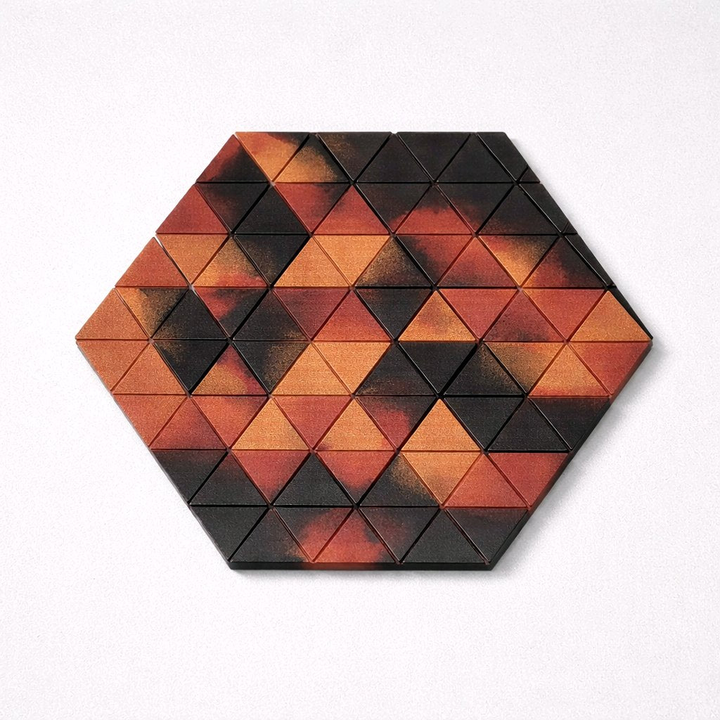 Hexagonal puzzle with triangular pieces in red and black on a white background