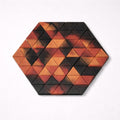 Hexagonal puzzle with triangular pieces in red and black on a white background