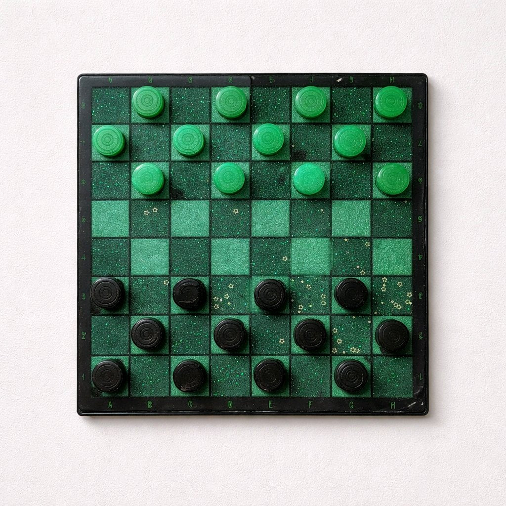 Checkers board with green and black pieces on a white background