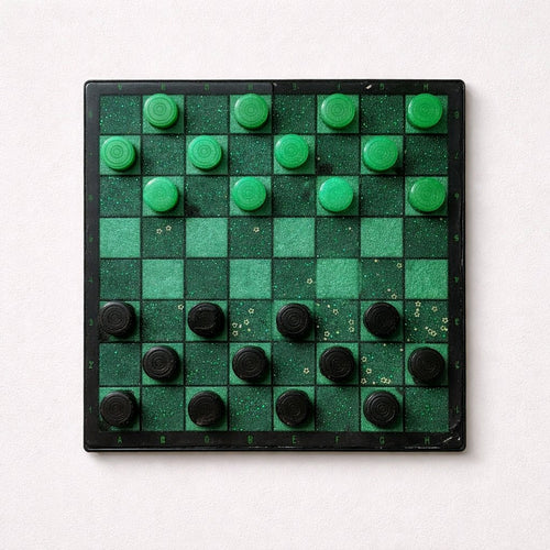 Checkers board with green and black pieces on a white background