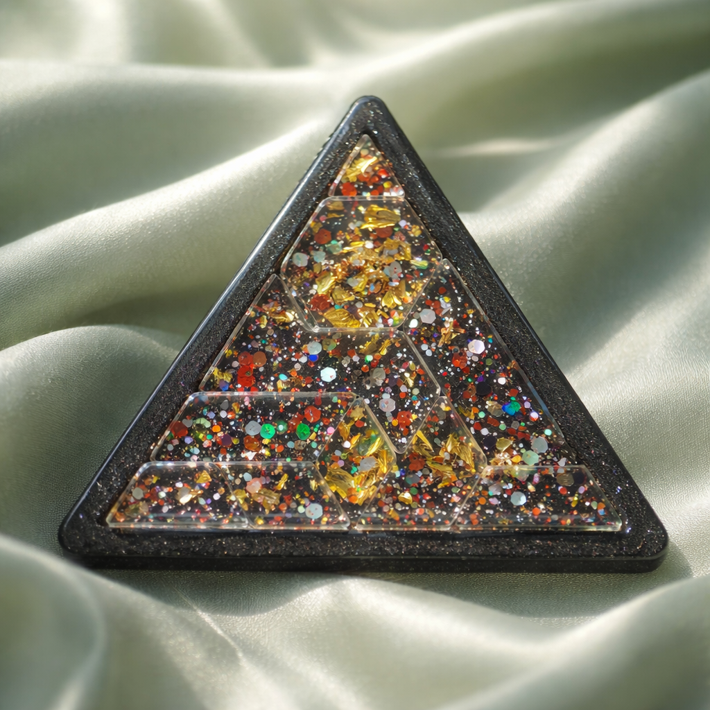Glitter triangle epoxy resin puzzle piece, close-up detail