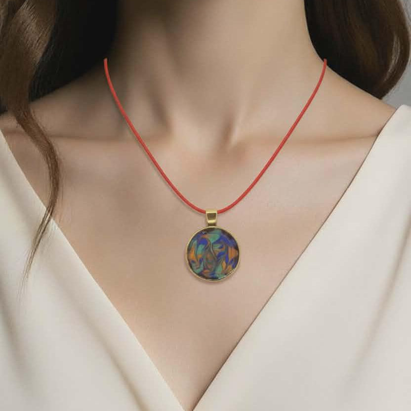 Necklace with a colorful pendant worn by a model against a neutral background