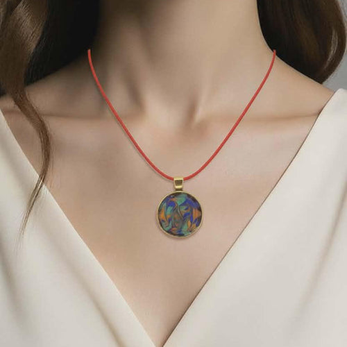 Necklace with a colorful pendant worn by a model against a neutral background