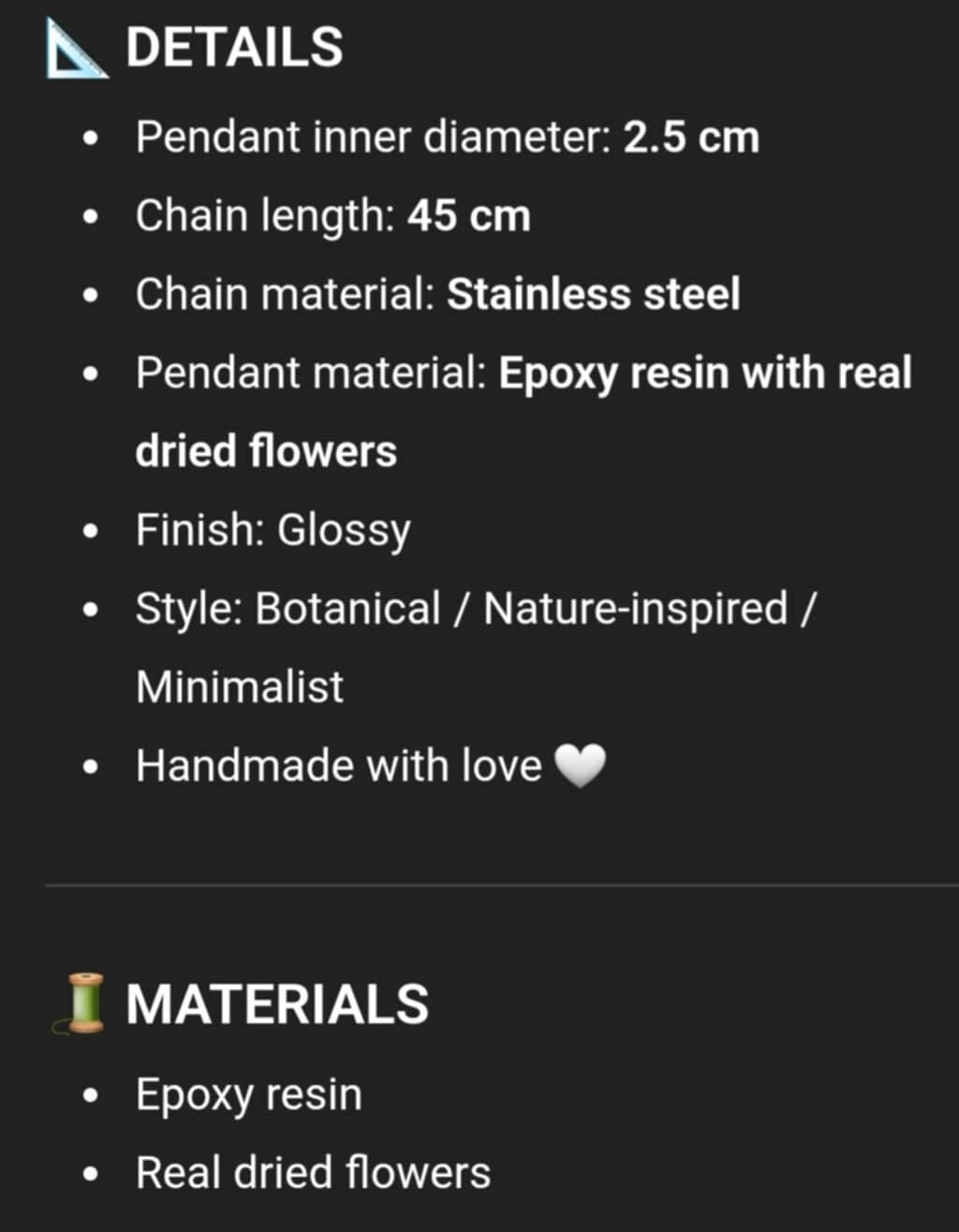 Product details of a pendant with chain on a black background