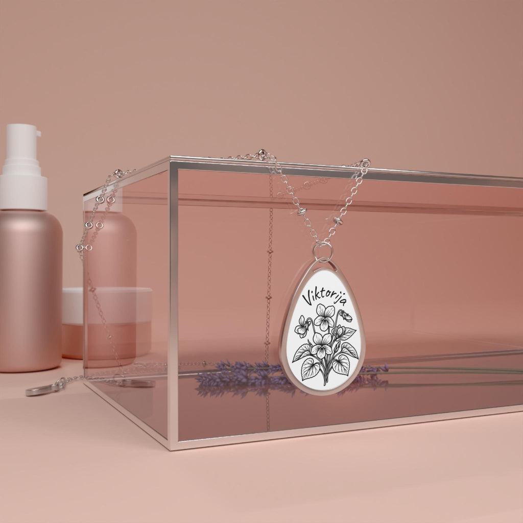Silver necklace with a birth month flowers pendant with your name.