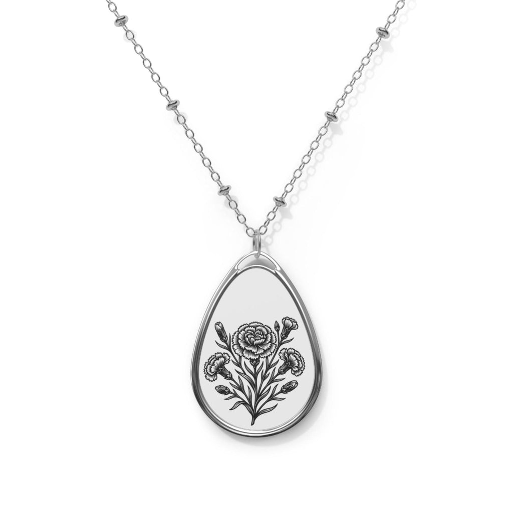 Teardrop - shaped pendant with floral design on a chain against a white background.