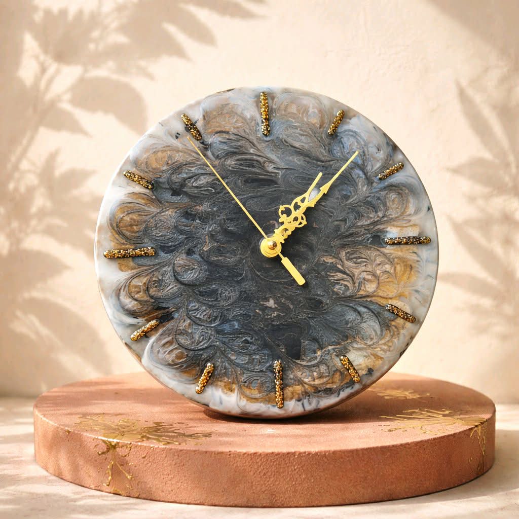 Decorative clock with gold accents on a wooden base against a beige background