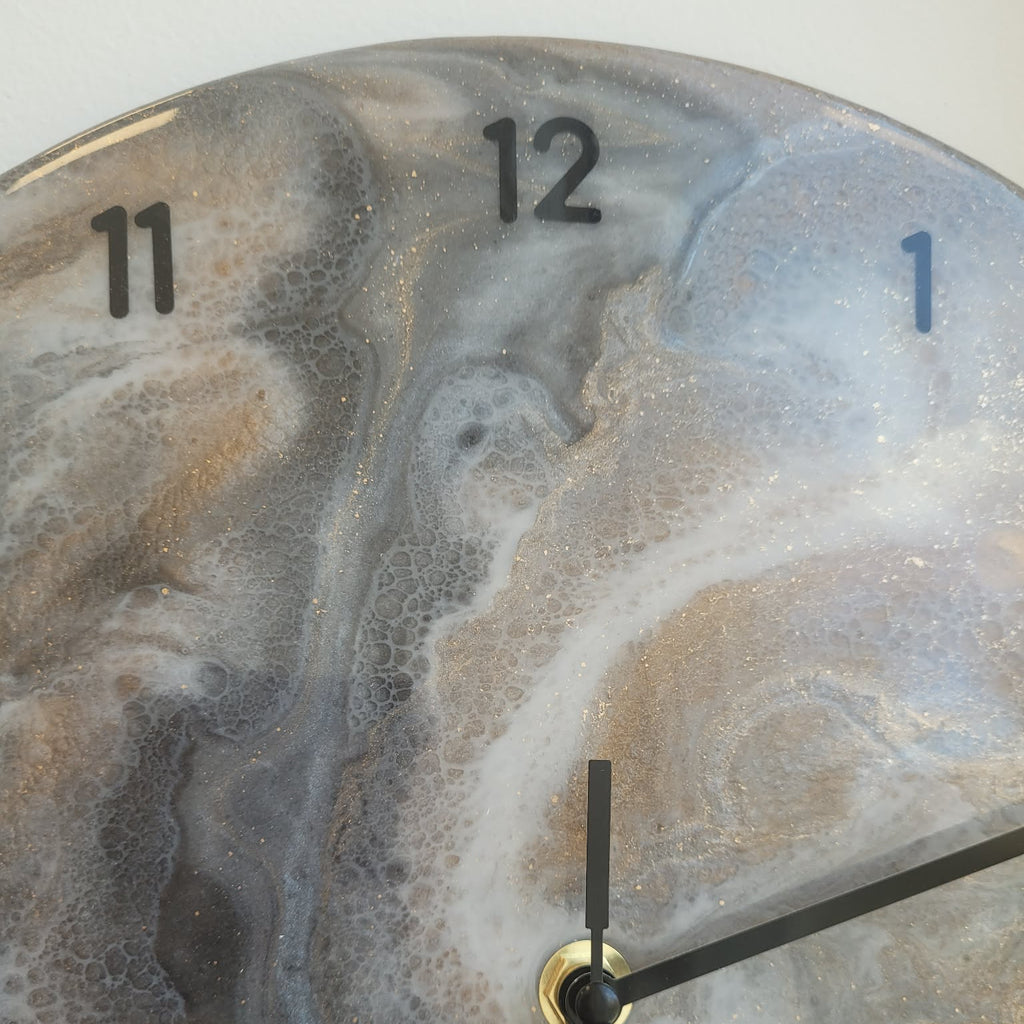 Clock with a marbled design on the face