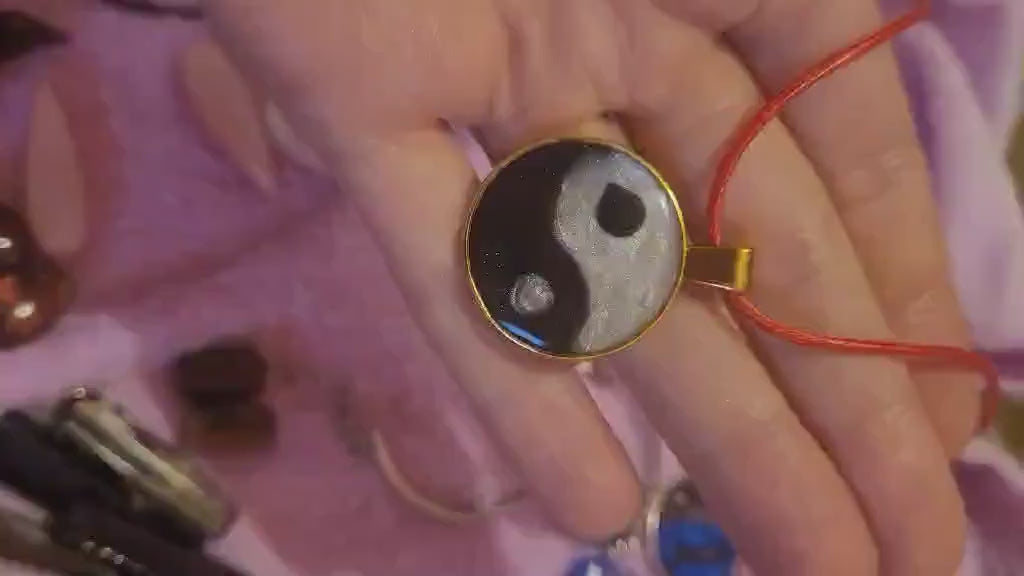 Real video with ying yang pendant