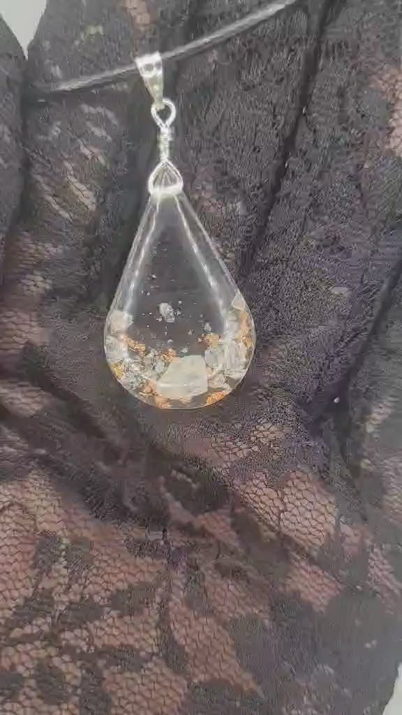 Video with teardrop pendant necklace. Inside is a himalayan stones and bronze  fakes.