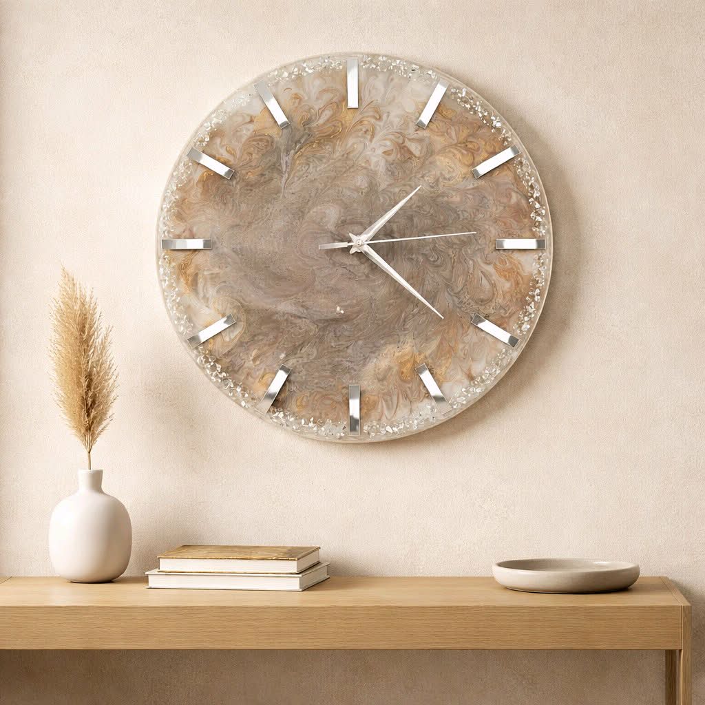 Decorative wall clock on a beige wall above a wooden console table with books and a vase.